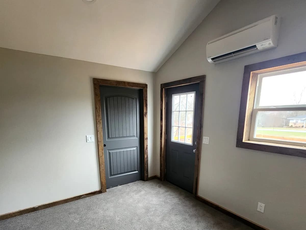 Vaulted room with rustic wood trim and custom finishes